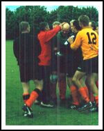 The Dutch congratulate their young keeper after his shoot-out heroics against the Pups