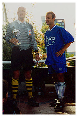 Erik (somewhat light-headed after his exertions) presents French captain Philippe Soria with the runners-up trophy.